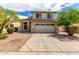 Charming two-story home with neutral paint, two car garage, and desert landscaping at 4245 E Shannon St, Gilbert, AZ 85295