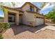 Charming two-story home with neutral paint, desert landscaping, and two car garage at 4245 E Shannon St, Gilbert, AZ 85295