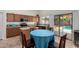 Eat-in kitchen featuring oak cabinets, stainless steel appliances, and backyard pool access at 4245 E Shannon St, Gilbert, AZ 85295