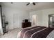 Large main bedroom with ceiling fan and view of the attached bathroom at 4245 E Shannon St, Gilbert, AZ 85295