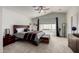 Spacious main bedroom featuring vaulted ceiling, ceiling fan, and carpeted floor at 4245 E Shannon St, Gilbert, AZ 85295