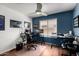 Comfortable office space with dual monitor setup, natural light, and cooling ceiling fan at 4245 E Shannon St, Gilbert, AZ 85295