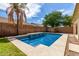 Backyard pool with spa and a brick wall on the backyard's perimeter at 4245 E Shannon St, Gilbert, AZ 85295