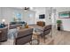 Bright living room with modern furnishings, ceiling fan, and hardwood flooring at 437 W 6Th Pl, Mesa, AZ 85201