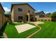 Beautiful backyard with a well-manicured lawn and a cozy patio area for outdoor enjoyment at 44328 W Knauss Dr, Maricopa, AZ 85138