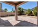 Spacious covered backyard with a large paved patio, ideal for outdoor gatherings at 44328 W Knauss Dr, Maricopa, AZ 85138