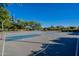 Community basketball court featuring multiple hoops, offering a great space for sports and recreation at 44328 W Knauss Dr, Maricopa, AZ 85138