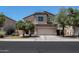 Charming two-story home with a two-car garage and well-maintained landscaping at 44328 W Knauss Dr, Maricopa, AZ 85138
