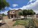 Charming two-story home featuring a covered porch and well-maintained landscaping at 44328 W Knauss Dr, Maricopa, AZ 85138