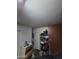 Garage space featuring a storage shelf and overhead lighting at 44328 W Knauss Dr, Maricopa, AZ 85138