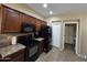 Well-lit kitchen featuring wood cabinets, black appliances, and tiled flooring for a modern look at 44328 W Knauss Dr, Maricopa, AZ 85138