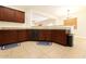 Kitchen offers modern appliances, tile floors, and beautiful countertops at 44328 W Knauss Dr, Maricopa, AZ 85138