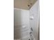 Shower featuring a white tiled wall and standard shower head at 44328 W Knauss Dr, Maricopa, AZ 85138