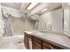 Bathroom vanity with drawers and a shower-tub combo, illuminated by modern lighting at 4442 E Redfield Rd, Phoenix, AZ 85032