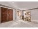 Dining room features a large front door, glass table, china cabinet, and plush carpet at 4442 E Redfield Rd, Phoenix, AZ 85032