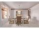 Dining room showcases a glass table, upholstered chairs, china cabinet and plush carpet at 4442 E Redfield Rd, Phoenix, AZ 85032