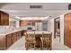 A kitchen featuring stainless steel appliances, center island with bar seating, and tile floors at 4442 E Redfield Rd, Phoenix, AZ 85032