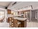 The kitchen is complete with stainless steel appliances and a center island with bar seating at 4442 E Redfield Rd, Phoenix, AZ 85032