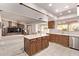 Open concept kitchen with island, stainless steel appliances and eat-in breakfast nook at 4442 E Redfield Rd, Phoenix, AZ 85032