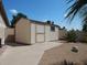 Exterior image of the shed with a window, set on a gravel-covered lot under a blue sky at 4442 E Redfield Rd, Phoenix, AZ 85032