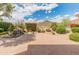Beautiful backyard features a waterfall and lush landscaping at 5936 W Via Montoya Dr, Glendale, AZ 85310