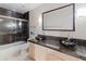Modern bathroom featuring vessel sinks, granite countertops, and glass shower door at 5936 W Via Montoya Dr, Glendale, AZ 85310