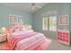 A pink princess-themed bedroom features pink carpet, bedding, and matching artwork at 5936 W Via Montoya Dr, Glendale, AZ 85310