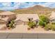 Beautiful home with three car garage, well maintained landscaping and mountain views at 5936 W Via Montoya Dr, Glendale, AZ 85310