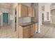 Functional hallway with built-in storage, connecting various rooms with neutral decor and tile flooring at 5936 W Via Montoya Dr, Glendale, AZ 85310