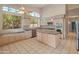 Bright kitchen features stainless steel appliances, an island, and large windows that provide lots of natural light at 5936 W Via Montoya Dr, Glendale, AZ 85310