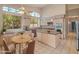 Bright kitchen features stainless steel appliances, an island, and large windows that provide lots of natural light at 5936 W Via Montoya Dr, Glendale, AZ 85310