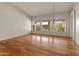 Bright open living space with hardwood floors, high ceilings, and scenic views through large windows at 5936 W Via Montoya Dr, Glendale, AZ 85310
