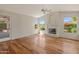 Spacious living room with fireplace, offering abundant light and scenic views at 5936 W Via Montoya Dr, Glendale, AZ 85310