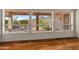 Expansive windows showcase a lush outdoor landscape with mature trees and a mountain backdrop at 5936 W Via Montoya Dr, Glendale, AZ 85310