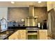 Well-equipped kitchen featuring stainless steel appliances, modern lighting, and a sleek design at 7157 E Rancho Vista Dr # 2005, Scottsdale, AZ 85251
