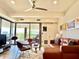 Modern living room with stylish furnishings, a ceiling fan, and access to a balcony with outdoor seating at 7157 E Rancho Vista Dr # 2005, Scottsdale, AZ 85251