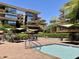 Community pool area featuring lush landscaping, comfortable seating, and a refreshing pool for residents to enjoy at 7157 E Rancho Vista Dr # 2005, Scottsdale, AZ 85251