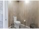Neutral toned bathroom with toilet and marble topped accent table at 7180 E Kierland Blvd # 1218, Scottsdale, AZ 85254