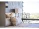 Cozy bedroom features luxury bedding, city views, and stylish decor in a contemporary design at 7180 E Kierland Blvd # 1218, Scottsdale, AZ 85254