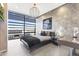 Stylish bedroom with modern lighting, sleek furniture, and large windows offering stunning city views at 7180 E Kierland Blvd # 1218, Scottsdale, AZ 85254