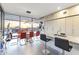 Open dining room with stunning city views and a modern chandelier over the table at 7180 E Kierland Blvd # 1218, Scottsdale, AZ 85254