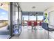 Contemporary dining area with red chairs, modern lighting, and beautiful views at 7180 E Kierland Blvd # 1218, Scottsdale, AZ 85254