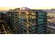 Contemporary high-rise architecture with landscaped balconies providing city views and sunset skies at 7180 E Kierland Blvd # 1218, Scottsdale, AZ 85254