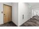 Hallway view with door, exit sign and fire extinguisher at 7180 E Kierland Blvd # 1218, Scottsdale, AZ 85254