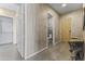 Modern hallway features neutral tones, a convenient bathroom, and a view to a closet at 7180 E Kierland Blvd # 1218, Scottsdale, AZ 85254