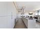 Open kitchen with stainless steel appliances, granite countertops, a center island, and a seamless connection to the living area at 7180 E Kierland Blvd # 1218, Scottsdale, AZ 85254
