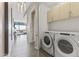 Well-lit laundry room features modern appliances and ample storage at 7180 E Kierland Blvd # 1218, Scottsdale, AZ 85254