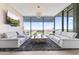 Bright living room featuring comfortable seating, a unique coffee table, and cityscape views at 7180 E Kierland Blvd # 1218, Scottsdale, AZ 85254
