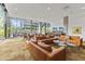 A modern lounge area with comfortable seating, coffee tables, and large windows at 7180 E Kierland Blvd # 1218, Scottsdale, AZ 85254