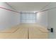 Well-maintained indoor squash court with wood flooring and glass walls for an active lifestyle at 7180 E Kierland Blvd # 1218, Scottsdale, AZ 85254